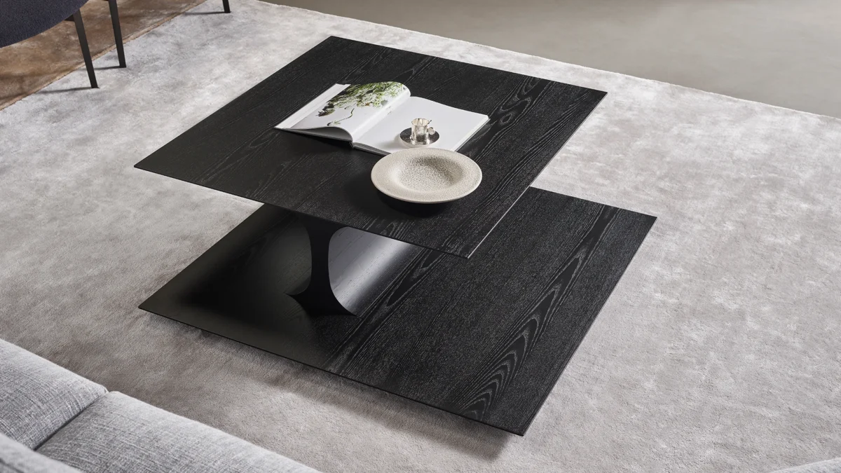 Japanese-inspired Bonaldo Kasumi low coffee table in coal ash veneer with elegant sinuous support between staggered tops