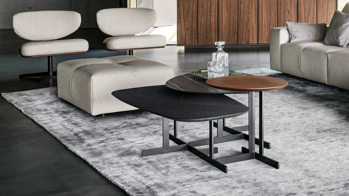 Fist side table by Bonaldo with bold oversized column support and warm walnut tabletop—perfect for a modern living area