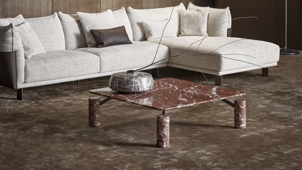 Magic coffee table with cylindrical marble legs and floating glass-top option on discreet metal frame by Bonaldo