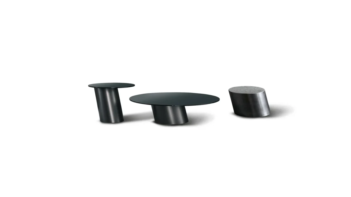 Bonaldo Pisa coffee table with slanted metal pedestal base and round smoked glass top, echoing the Leaning Tower of Pisa