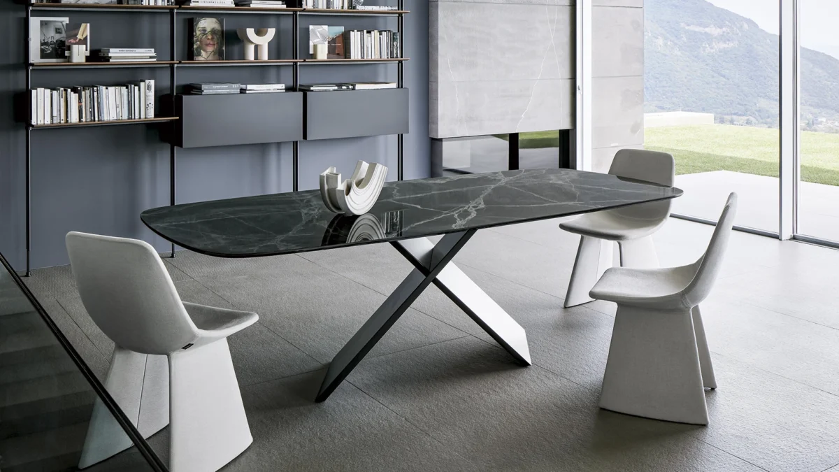 AX table by Bonaldo featuring sturdy criss‑cross metal legs in burnished finish paired with walnut veneer surface