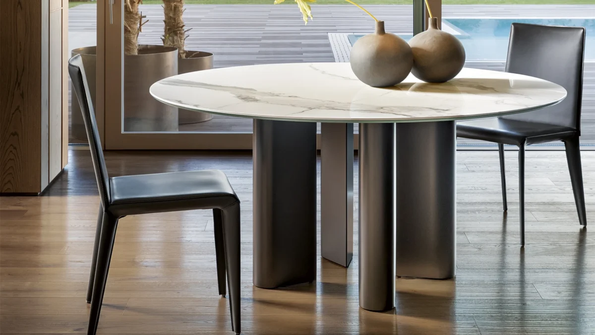Alain Gilles designed Geometric Table Wood—solid ebony wood top and legs appear thick or slender from angles