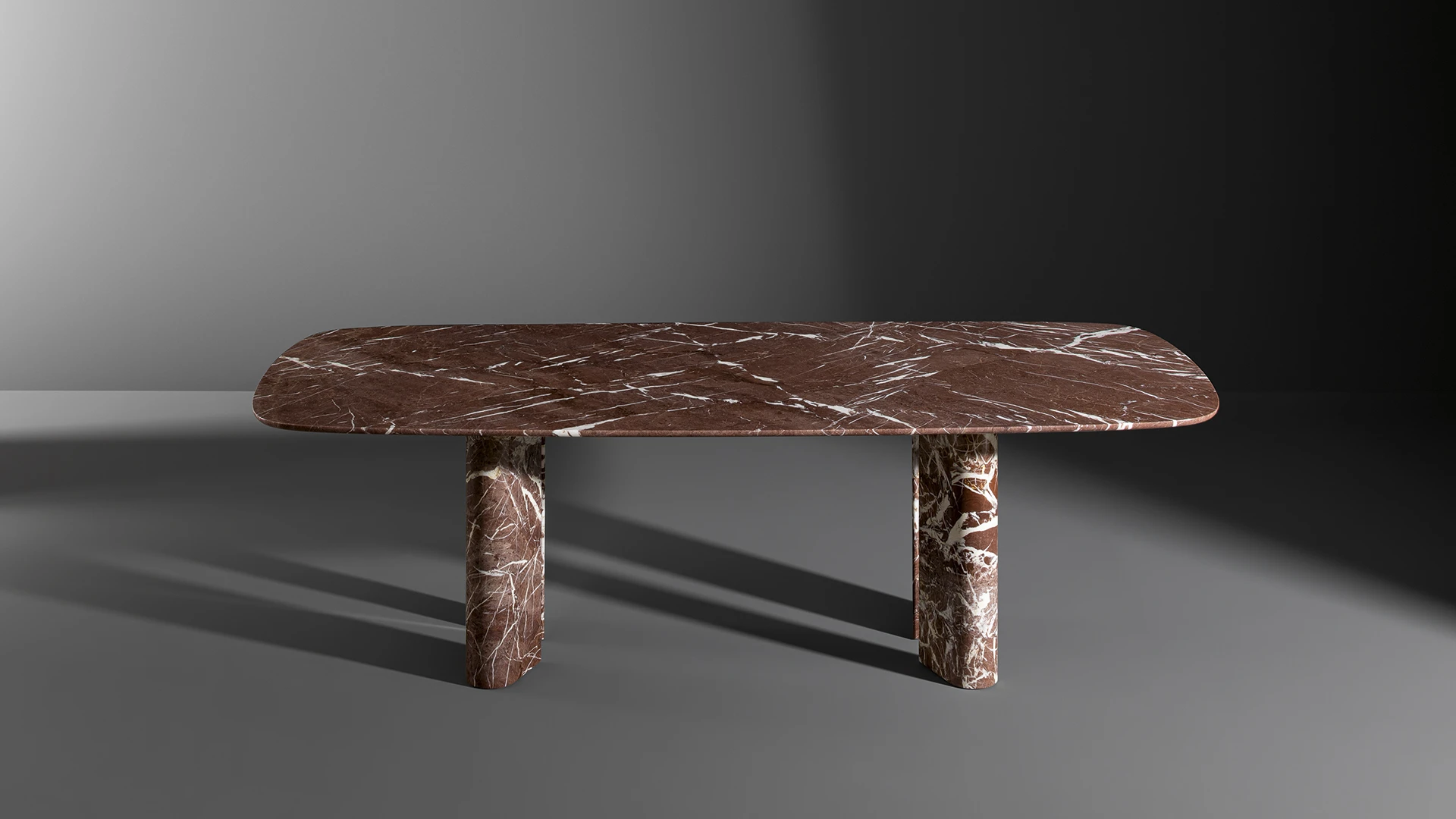 Bonaldo Geometric Table Wood in ebony finish with four teardrop‑shaped legs creating a chameleon visual effect