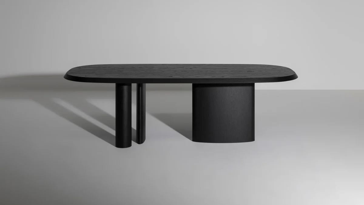 Bonaldo Padiglioni table with asymmetrical three‑leg wood base and rounded Canaletto walnut tabletop