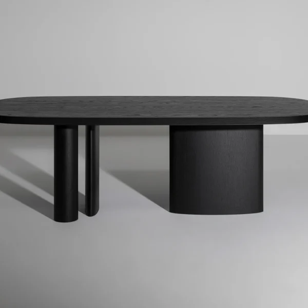 Bonaldo Padiglioni table with asymmetrical three‑leg wood base and rounded Canaletto walnut tabletop