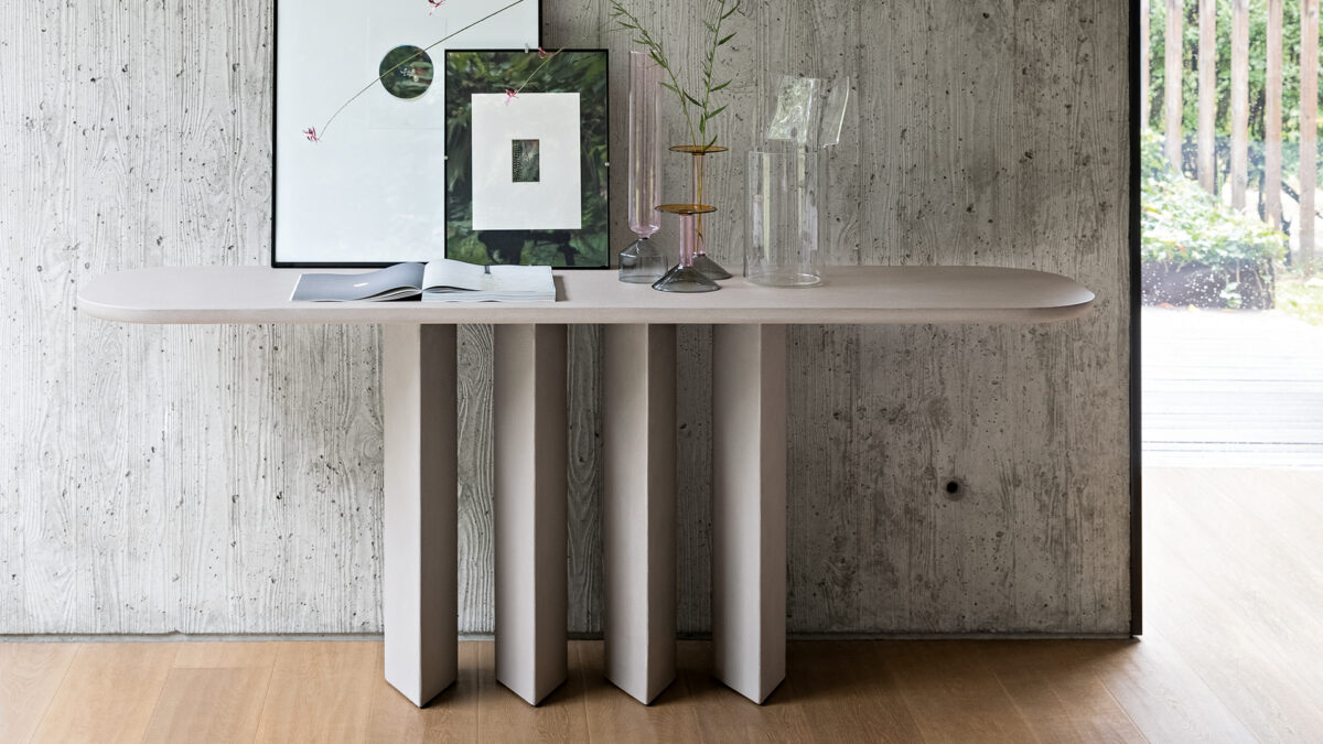 "Geometric Console with black lacquered metal legs and slim ceramic top in marble effect."