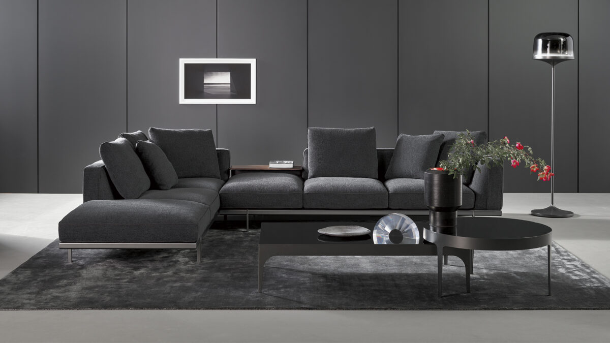"Phil chair in fabric upholstery with clean lines and minimalistic silhouette."