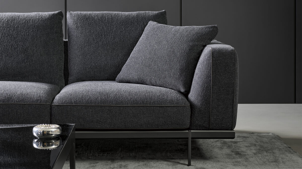 "Phil chair by Bonaldo featuring a sleek, modern design with a gently curved backrest and slim legs."