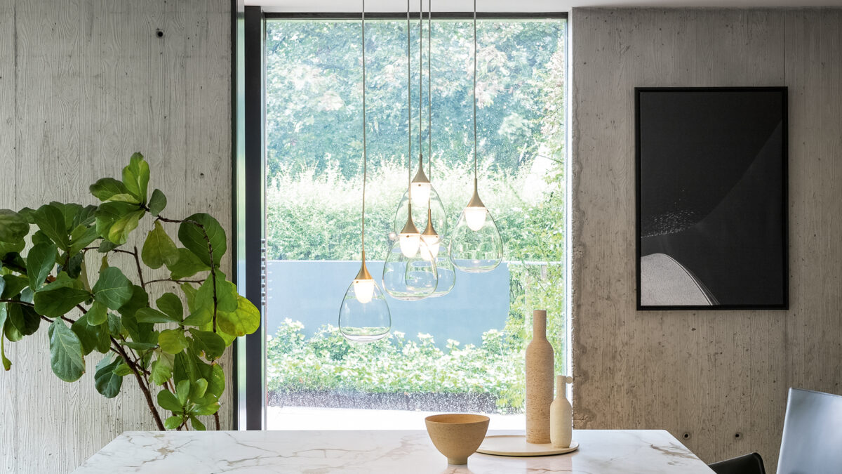 "Arrangement of Drops by Bonaldo reflecting light in an artistic and functional wall display."