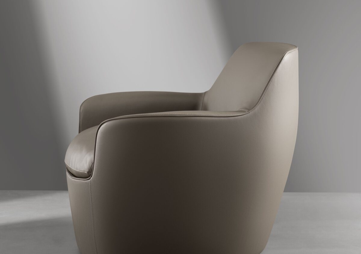 Contemporary Next armchair by Bonaldo in smooth upholstery with cantilevered stool module and concealed base