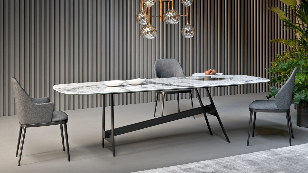 “Miss My Way Large armchair by Bonaldo with high enveloping shell backrest and tapered metal legs.”