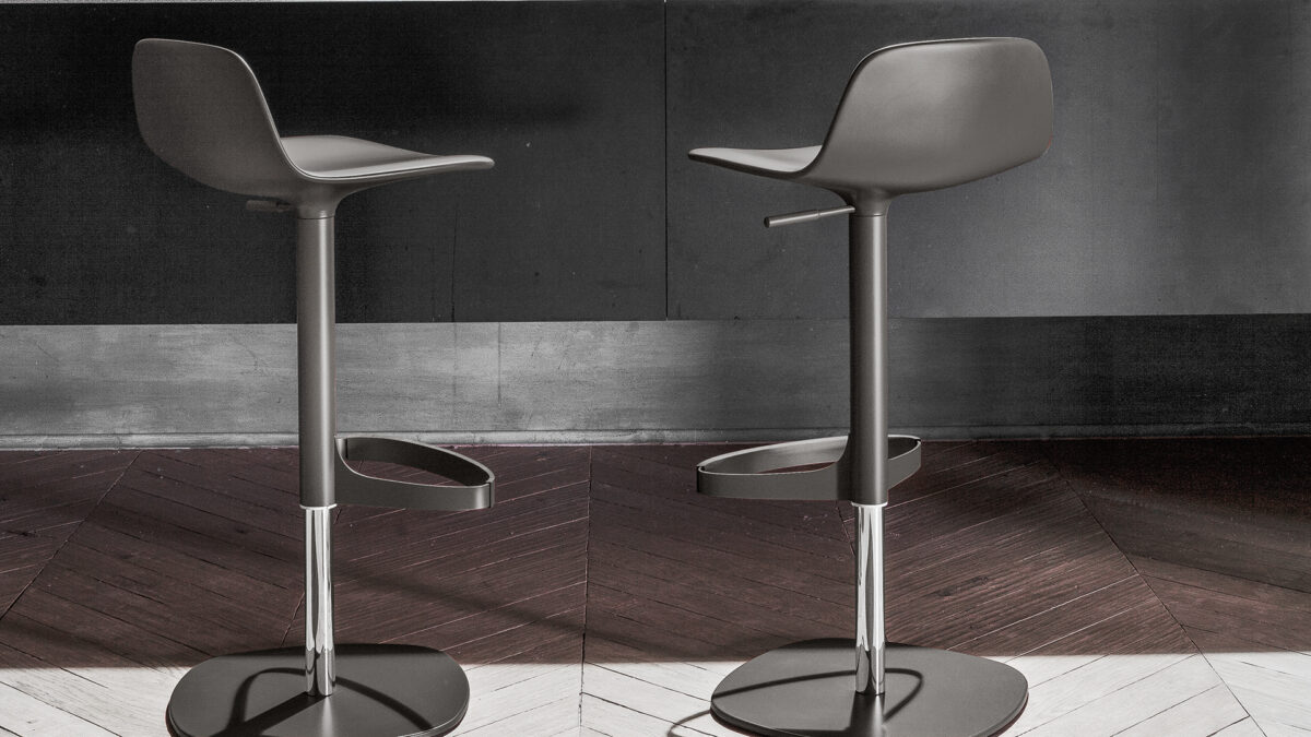 "Bonnie chair in velvet upholstery with delicate stitching and tapered black metal legs."