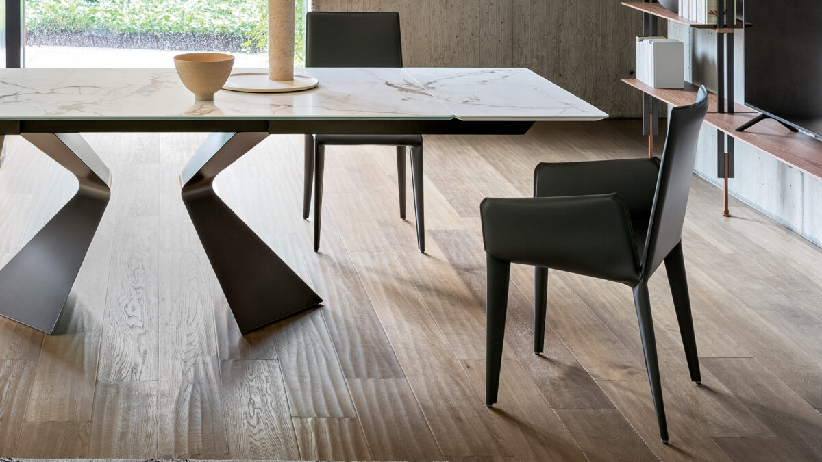 "Side view of Filly Up chair showcasing high upholstered backrest and elegant proportions."