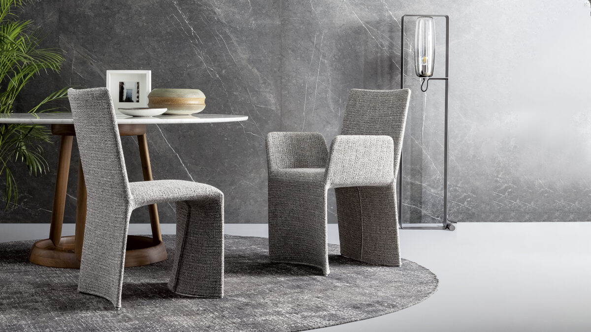 "Side view of Ketch chair showing its sail-inspired backrest and minimalist base."