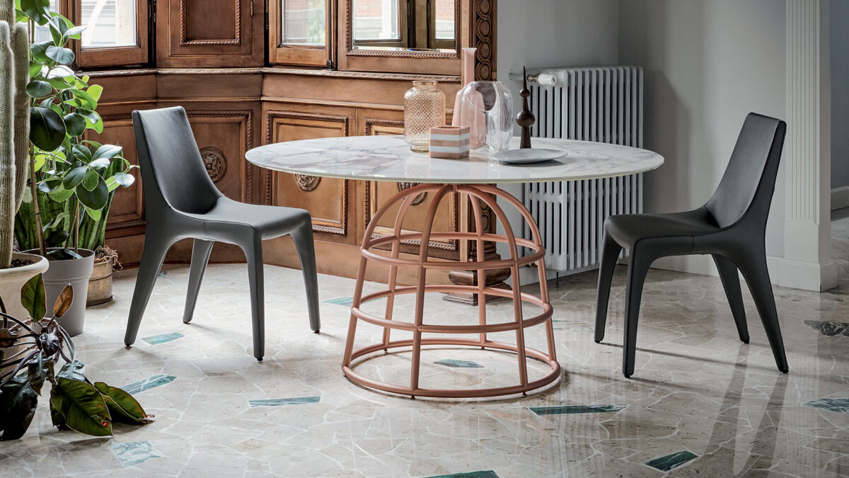 "Tip Toe chair by Bonaldo with soft cushioned seat and minimalist metal base in dark finish."