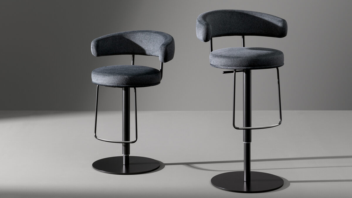 "Elegant Neuilly Too stool designed by Fabrice Berrux with sleek, curved backrest."