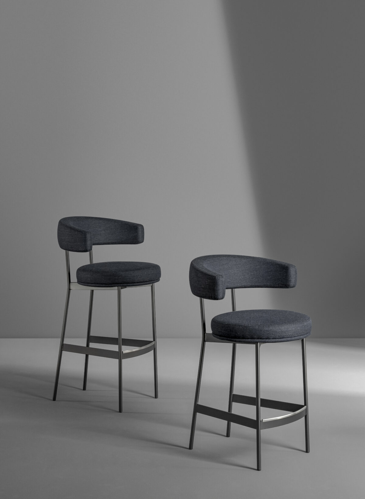 "Modern Neuilly Too bar stool featuring ergonomic backrest and fabric upholstery."