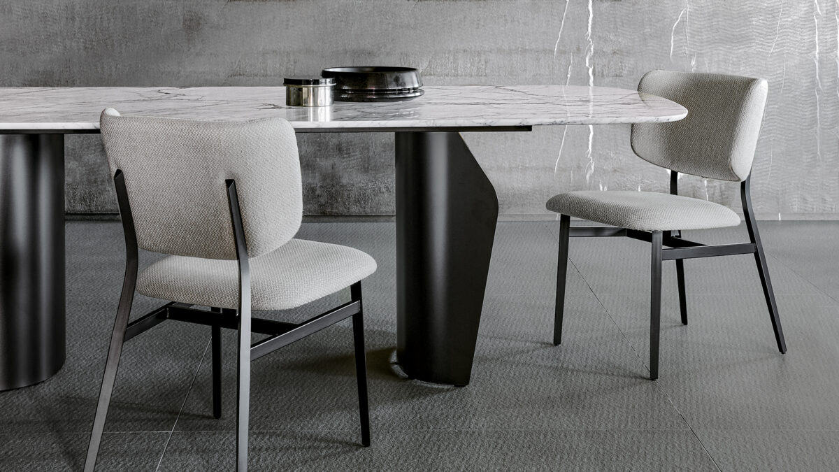 "Modern Noor chair by Bonaldo combining lightweight steel base and comfortable fabric padding in neutral tones."