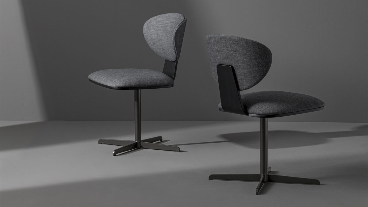 "Olos Office Chair by Bonaldo featuring a curved laminated wood backrest and ergonomic polyurethane seat on a cross-shaped metal base."