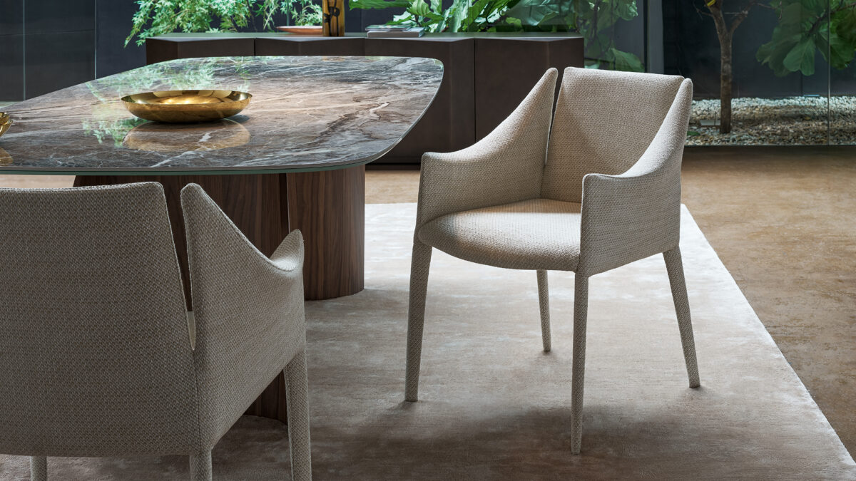 "Modern Candle chair with sleek minimalist design and upholstered seat."