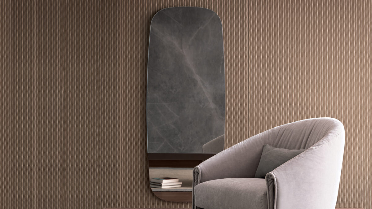 "Lake by Bonaldo in a deep blue glossy finish with smooth, continuous curved panels."