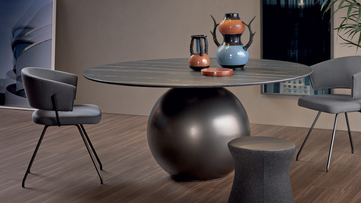 Bonaldo Circus round dining table with ceramic top and matte bronze metal sphere support