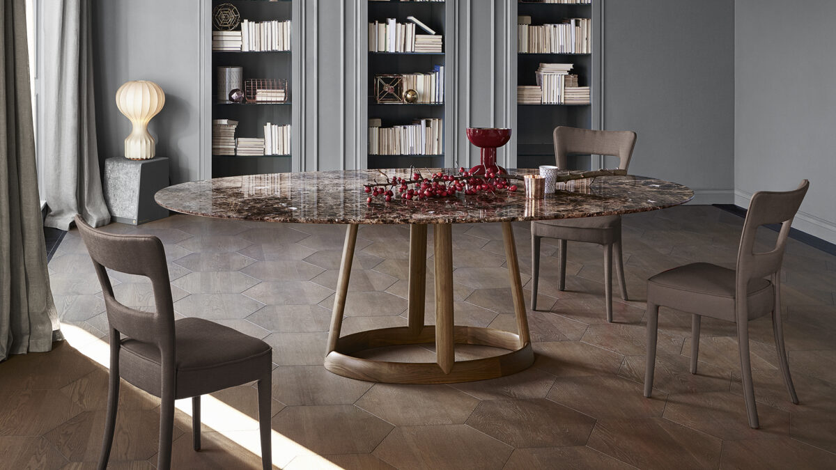 Bonaldo Greeny table featuring a wood pedestal base in coal ash and a thin ceramic rising top