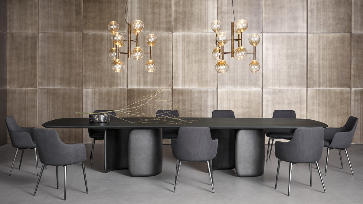 "Modern dining table Mellow by Bonaldo showcasing organic, flowing lines with a central embrace-style base."
