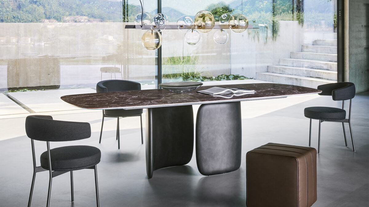 "Sculptural Mellow table by Bartoli Design for Bonaldo featuring a soft, barrel-shaped base in rigid polyurethane and a ceramic top."