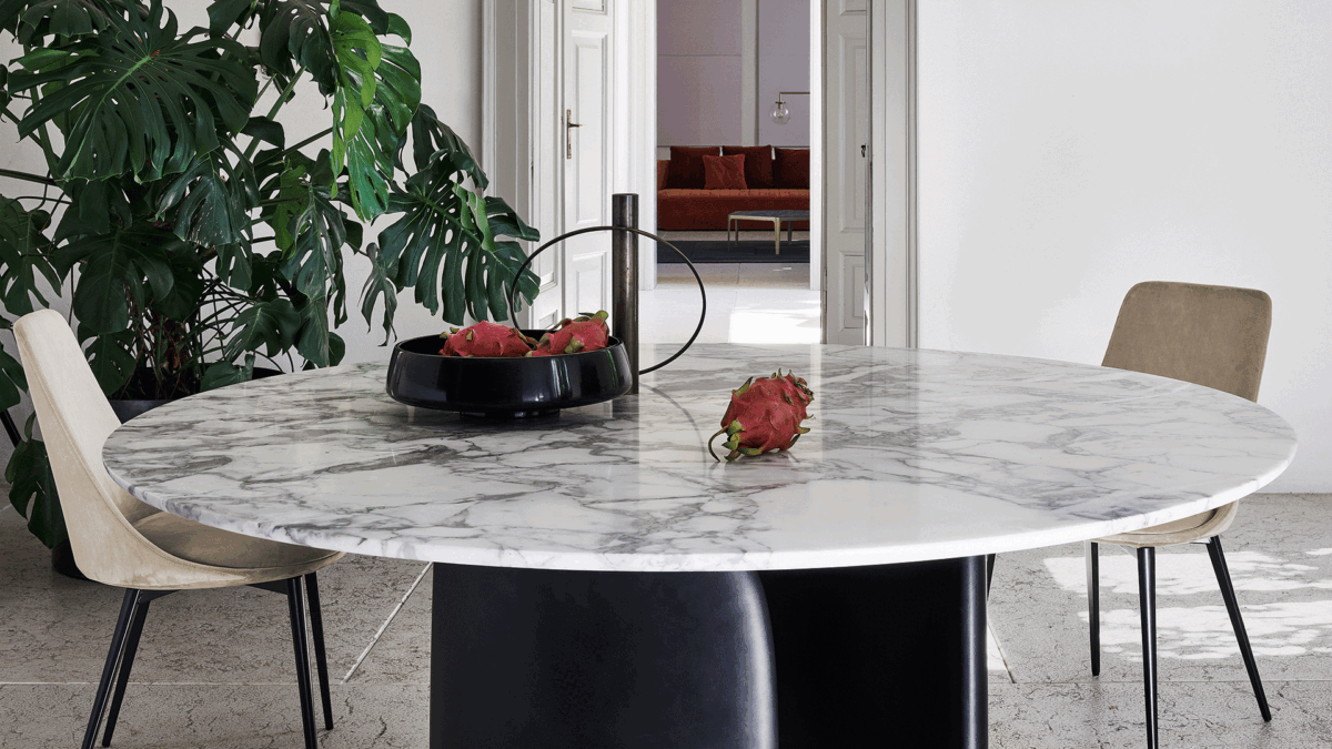 "Bonaldo Mellow table with twin volumetric base elements in a sinuous curve supporting a round or softly rectangular top."
