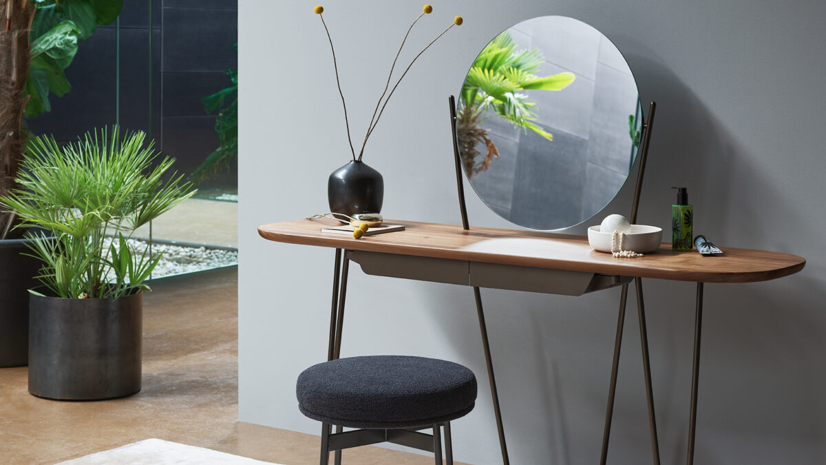 "Cosine dining chair with sleek silhouette and comfortable wraparound backrest."