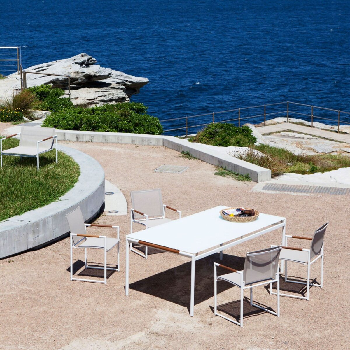“Breeze Dining Chair by Harbour – contemporary outdoor chair with woven rope back and sleek frame”
