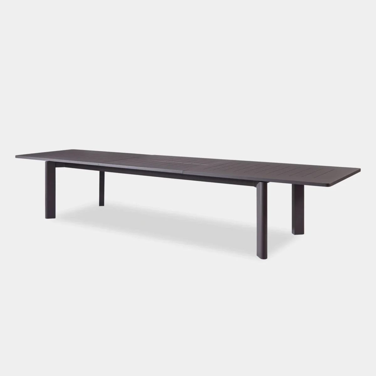 “Extended Byron Aluminum Table with dining chairs – perfect for open-air gatherings”