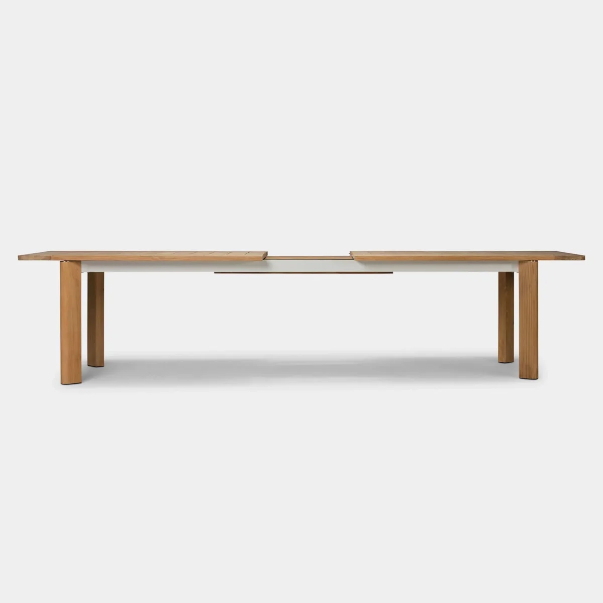 “Teak patio dining setup with Byron extension table – durable and stylish for open-air meals”