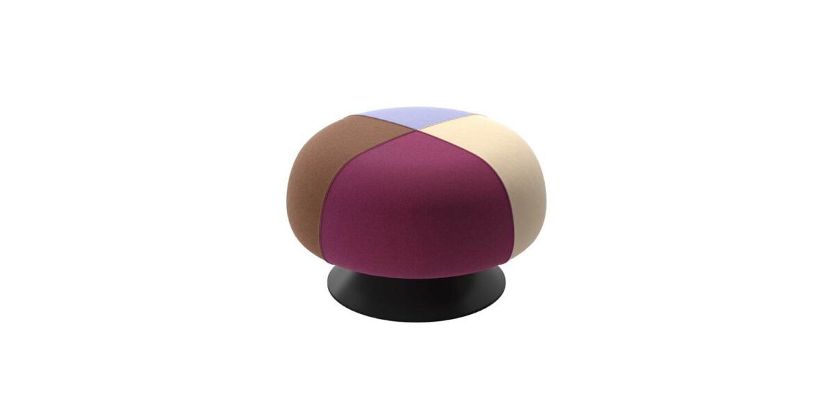 “Cozy corner with Lud’o Pouf upholstered in mustard fabric, featuring soft rounded form and padded seat.”
