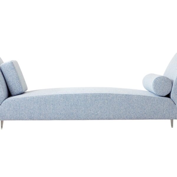 “Overhead perspective of the Daybed’s rectangular profile and symmetrical arm bolsters against a neutral rug.”