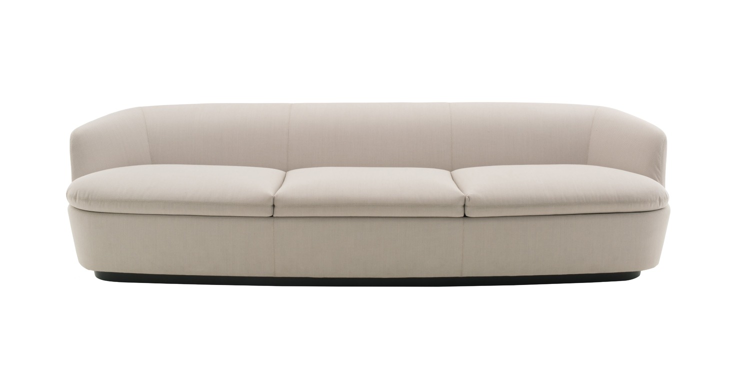 “Detailed shot of Orla’s swivel base and organic curves, upholstered in rich dark leather.”