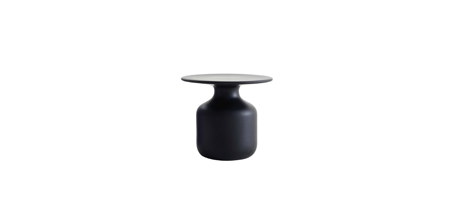 "Design-forward small table blending whimsy and function – Mini Bottle by Cappellini."
