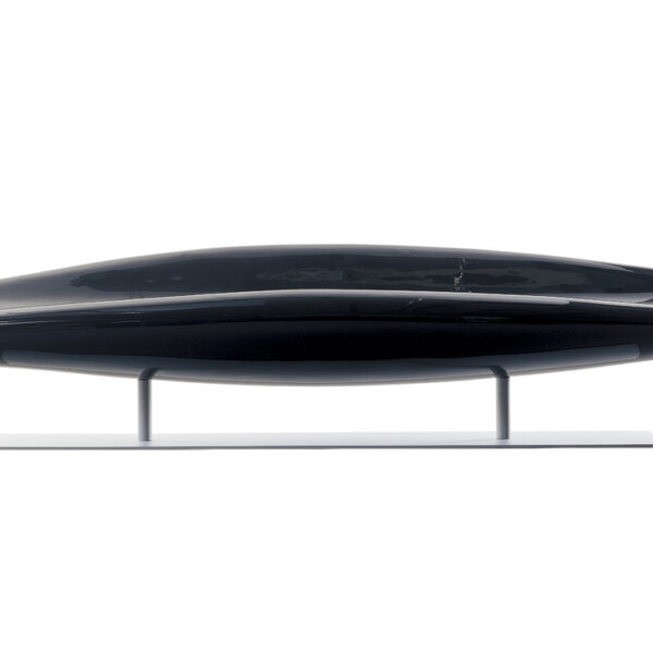 “Three-quarter shot of InOut paddle‑shaped bench upholstered in deep red lacquered fiberglass on a sleek metal pedestal.”