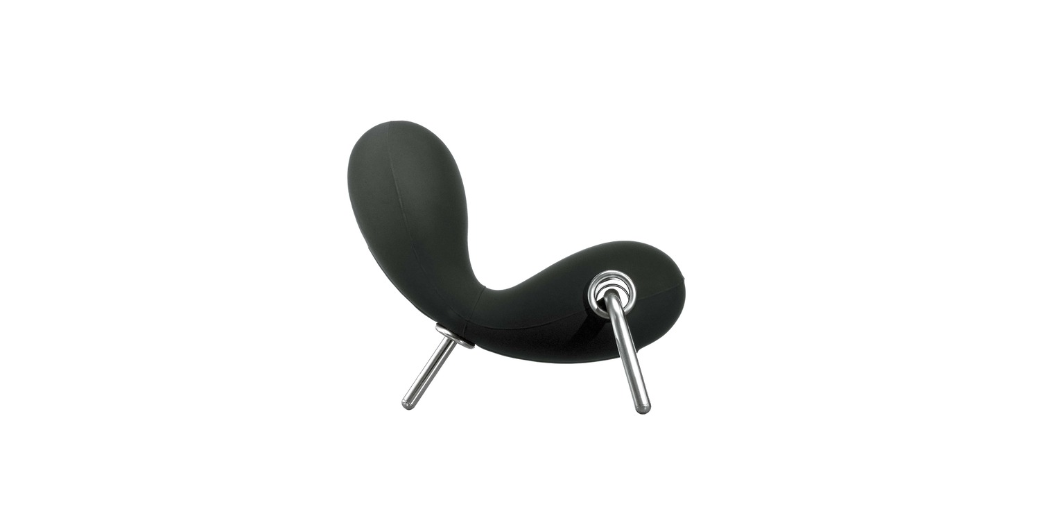 "White Embryo lounge chair in a studio setting, highlighting its soft curves and sinuous silhouette."