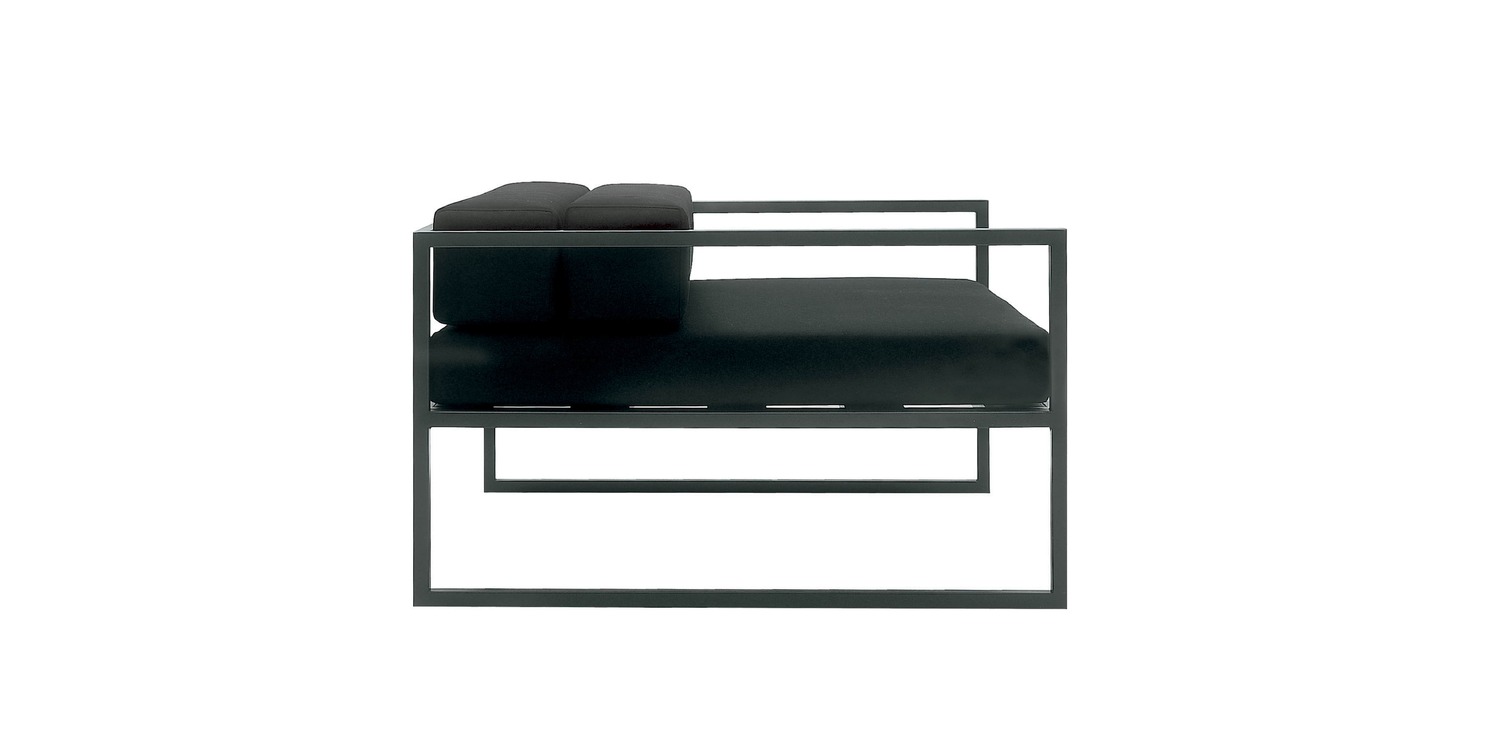 "Detail of the removable cover of Fronzoni '64 Armchair in black synthetic leather."