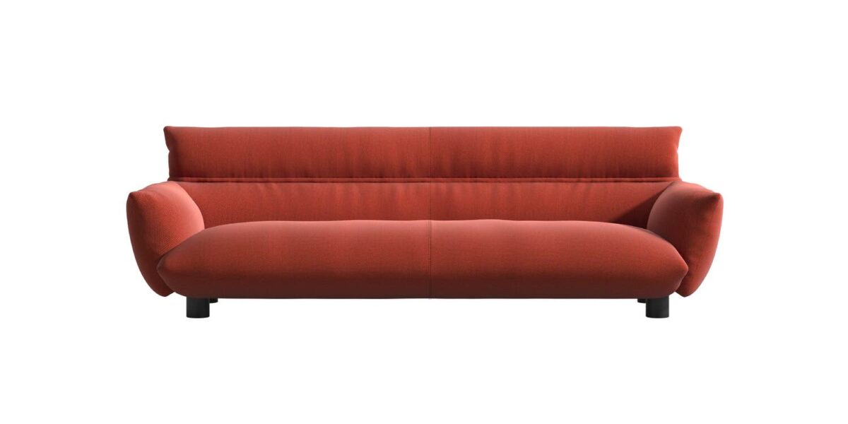 “Detail close‑up of Lud’o Sofa’s removable cover, pillowy form, and upholstery stitching over a recycled‑plastic frame.”