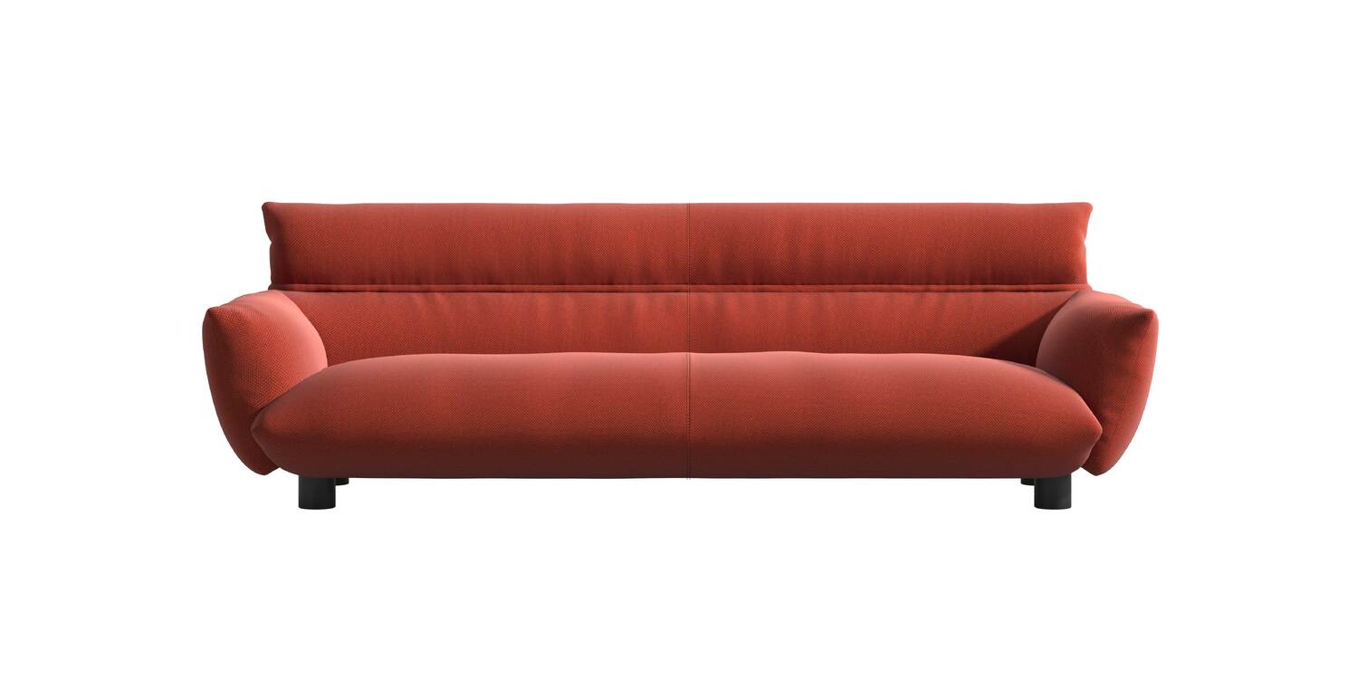 “Detail close‑up of Lud’o Sofa’s removable cover, pillowy form, and upholstery stitching over a recycled‑plastic frame.”
