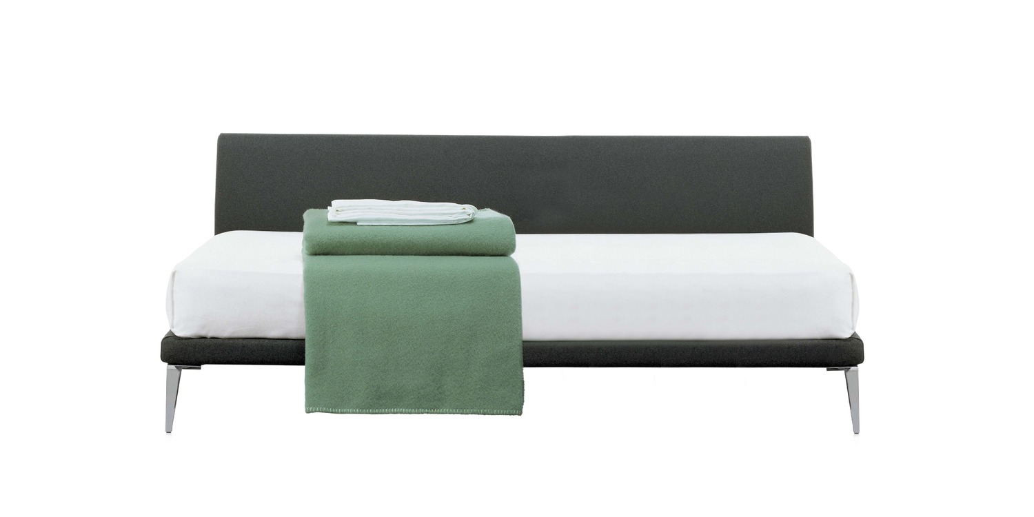 "Contemporary bed with streamlined structure and soft, inviting upholstery – by Cappellini."