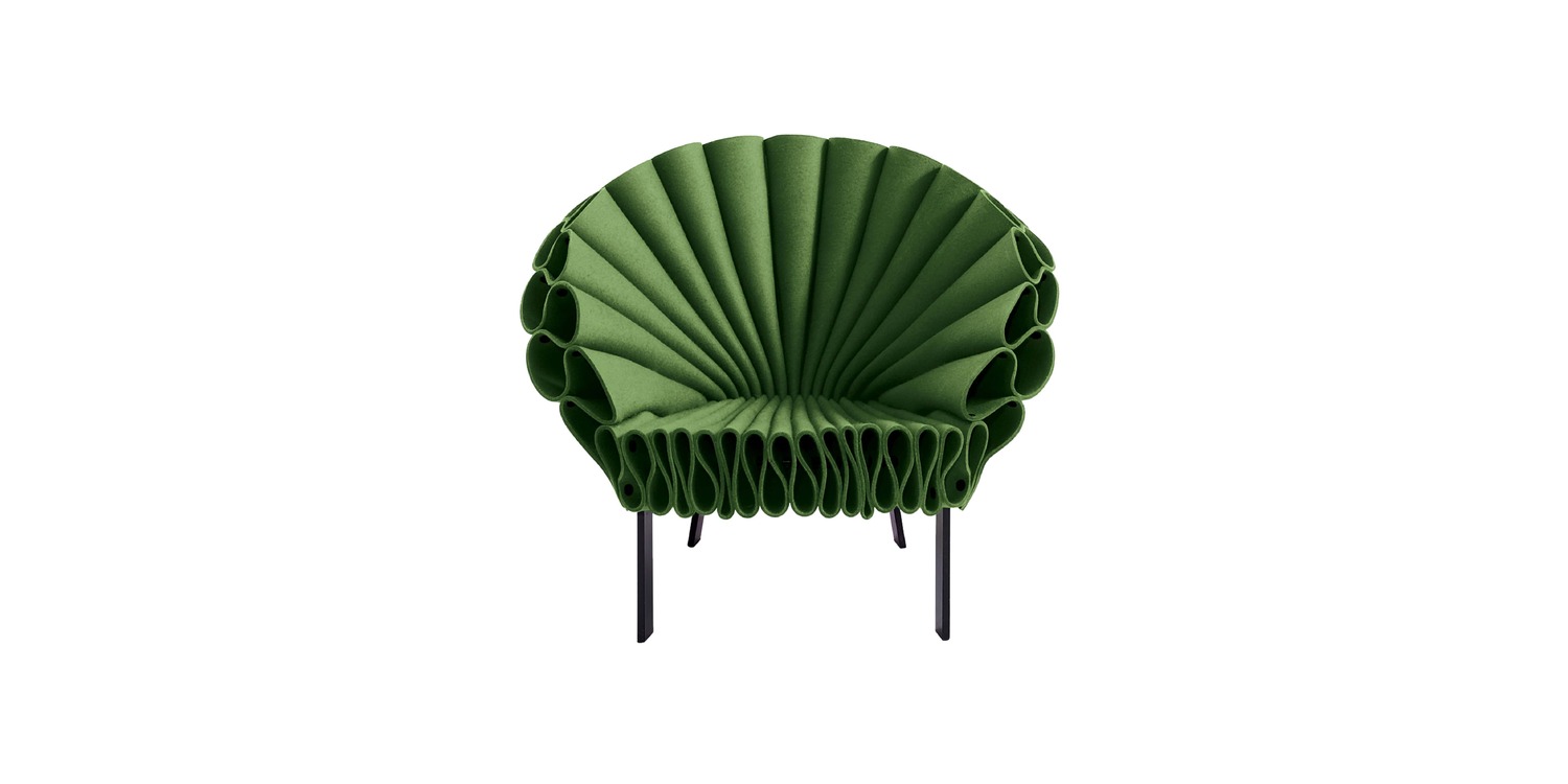 "Detail shot of the felt folds wrapping into tubular loops along the armrest on the Peacock chair."