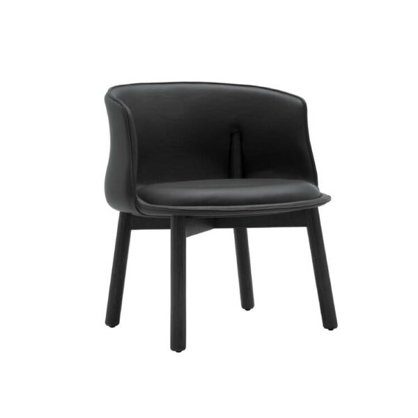 "Peg Armchair photographed in natural light, showing warm-toned upholstery contrasted with ash wood legs."