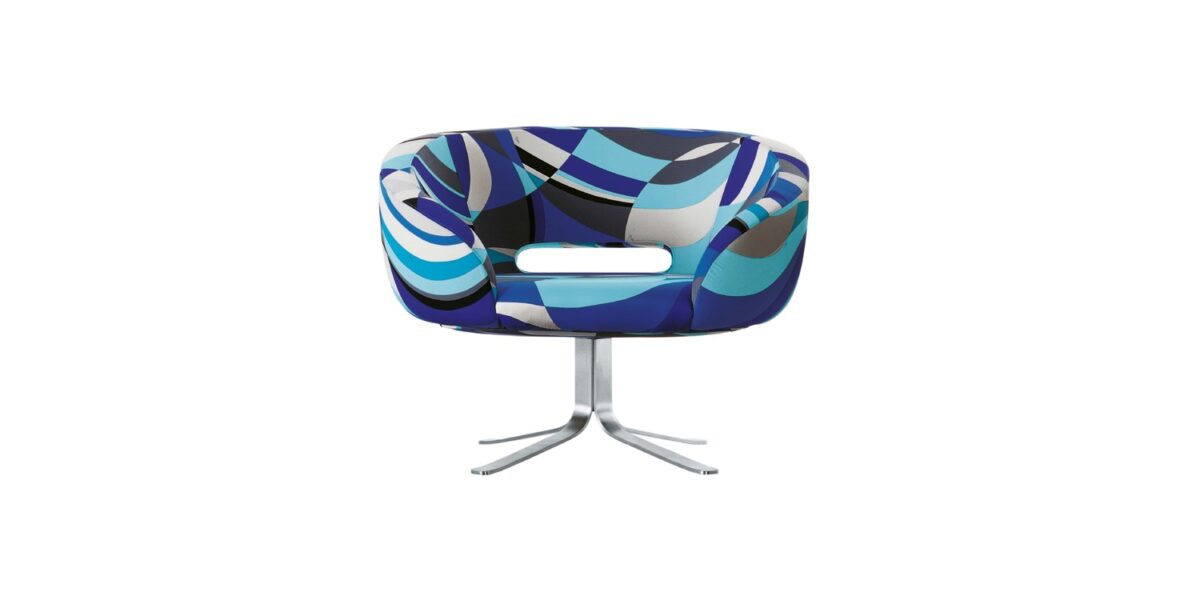 "Back view of Rive Droite chair showing the gentle curve of its padded backrest and stainless-steel pedestal."