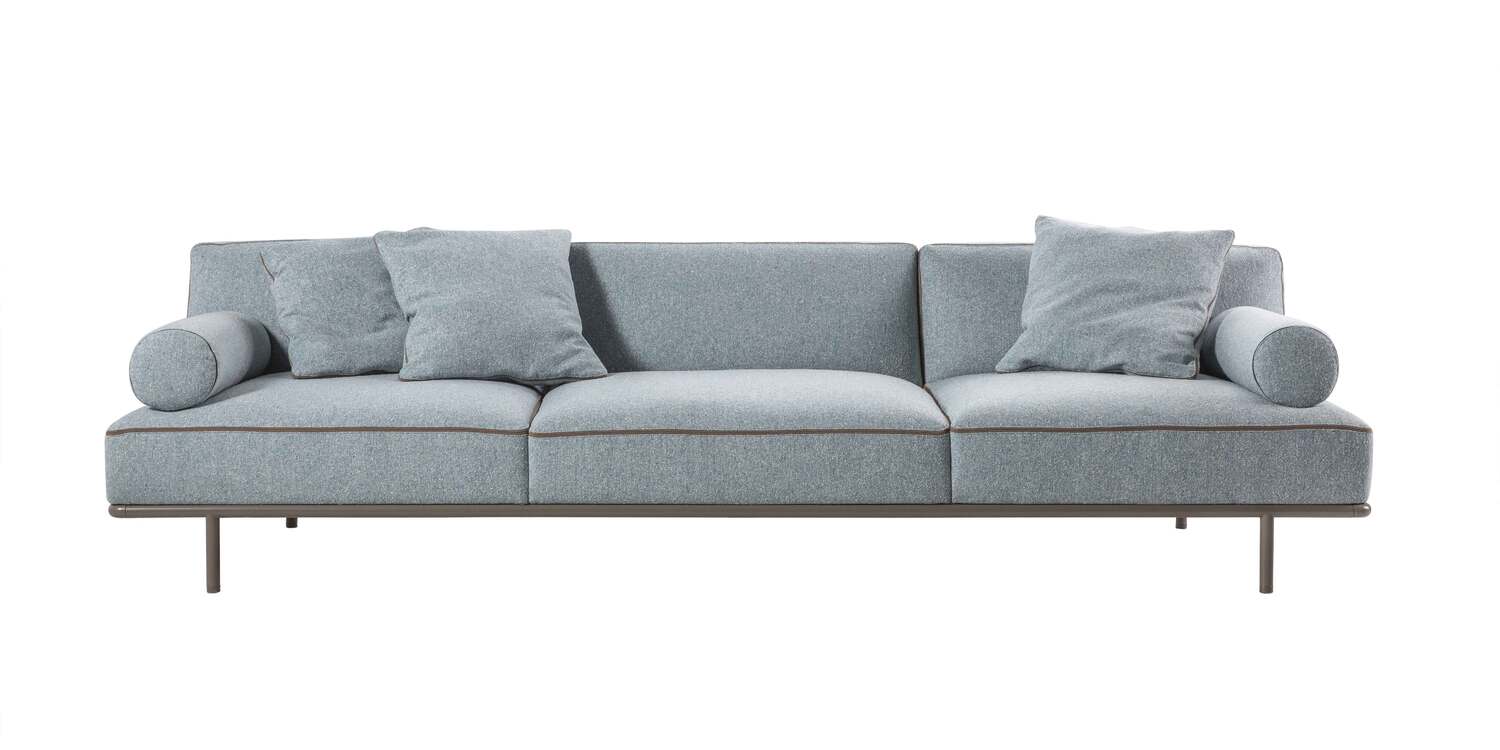 “Cap Martin Sunset lounge setup in a bright interior, featuring detachable cushions and polished chrome base, evoking a vintage minimal aesthetic.”