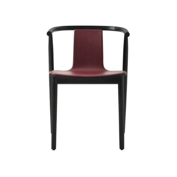 "Detail shot of the curved backrest and black polypropylene foot on a fabric‑front Bac chair."