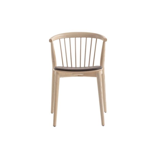 "Detail shot of the smooth bend where the curved backrest meets the seat on the Newood wooden chair."